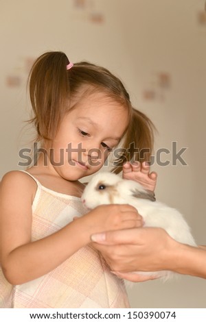 young girl with a small rabbit
