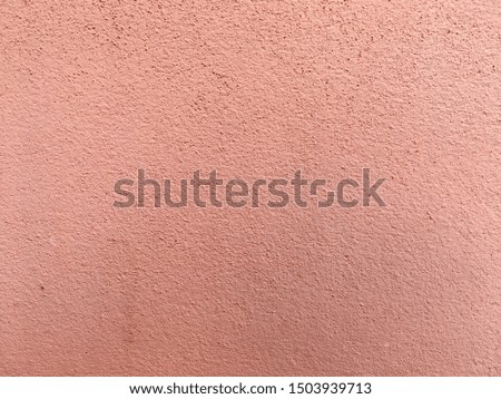 Retro pink concrete wall background and texture