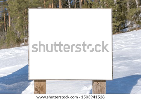 big empty blank white poster wooden sign in snowy recreation park in winter season, mock-up