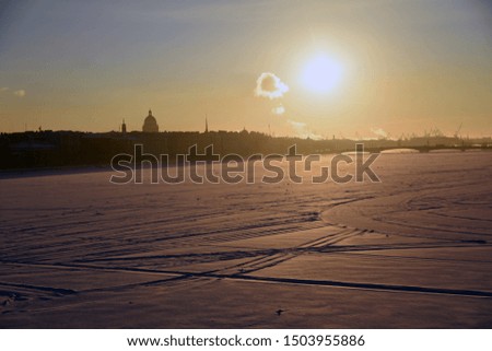 The frozen Neva river and view of historical city center of Saint-Peteraburg, Russia. Color winter photo.