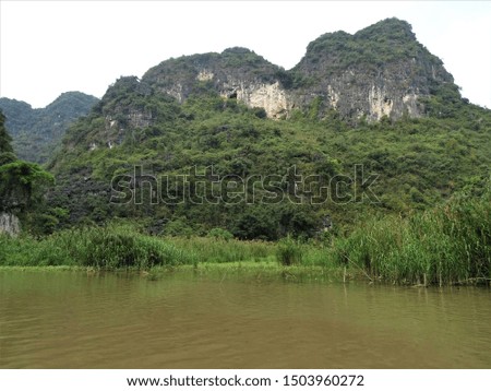 Tam Coc River with limestone mountains in Vietnam, Ninh Binh district