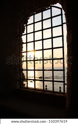 Metal Grid and Mediterranean Sea and Sunset, South Italy 