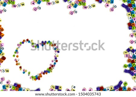 Colorful English alphabet frame with alphabet heart shape on isolalted white backgroung
