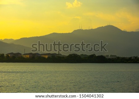 beautiful sea view with mountain during sunset 