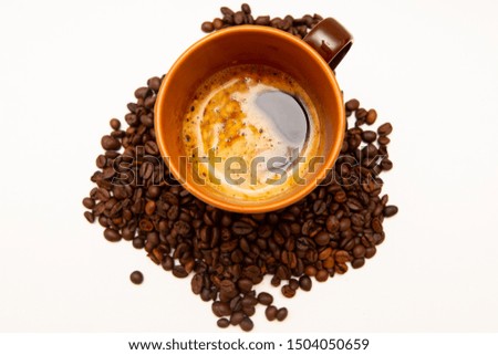 Cup of hot coffee in the morning. With beans coffee roasted image.