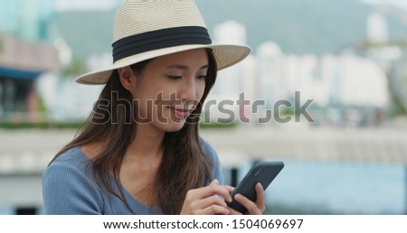 Travel woman use of mobile phone for checking the locatio