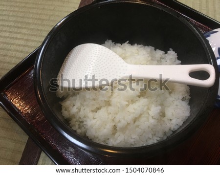 Traditional rice pot with rice spoon