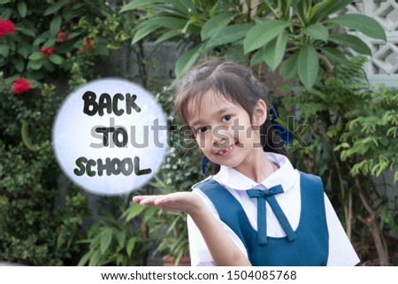 Education concept of Back to school holding by Asian girl in school uniform
