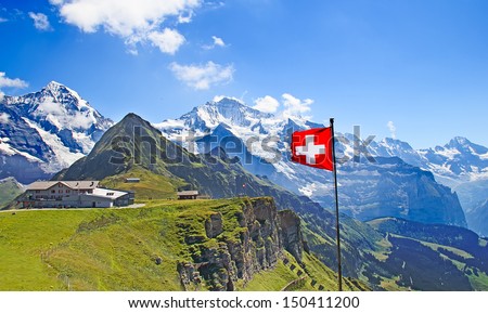Swiss flag on the top of Mannlichen (Jungfrau region, Bern, Switzerland) Royalty-Free Stock Photo #150411200
