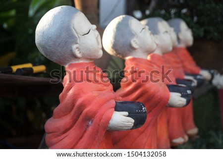 buddhist monk sculptures in temple.