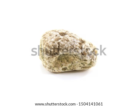 One stone isolated on white background.Stones come in many sizes.They are used in construction decoration or garden arrangement.Natural rock and some parts have been made by humans.