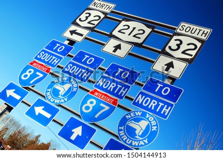 Signs point to different routes in Upstate New York Royalty-Free Stock Photo #1504144913
