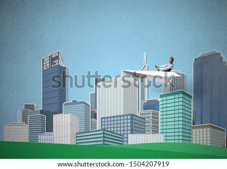 Businessman in aviator hat sitting in paper plane and holding steering wheel. Happy pilot driving paper plane on background of cartoon business center with high skyscrapers and office buildings.