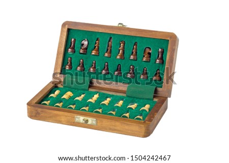 open wooden chessboard with figures in green velvet, closeup isolated on white background