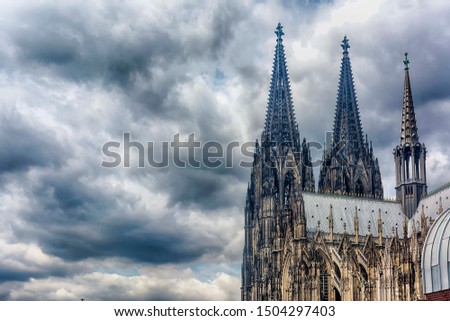 Spiers of Cologne Cathedral (Kölner Dom) against the background of an expressive cloudy sky. Cologne North Rhine Westphalia Germany