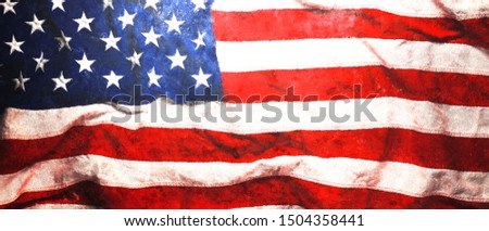 Rough faded US American flag background or Patriotic wallpaper