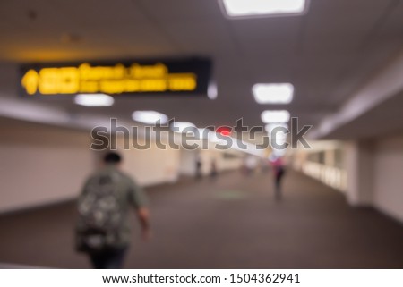 Blur passengers traveller for holiday or business trip in airport background.