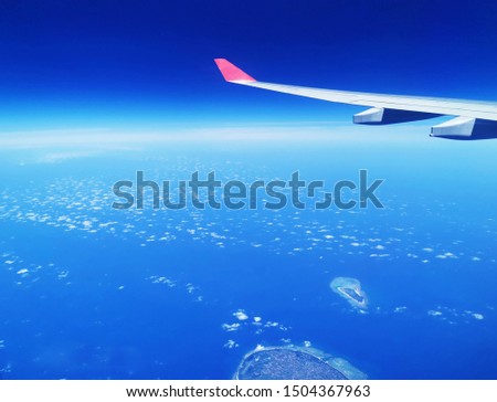 Aircraft Wing - Cloudy and blue sky for background