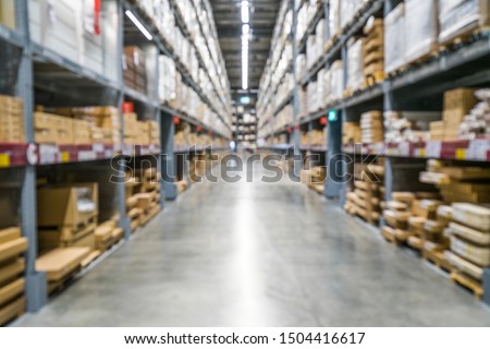 Blurred perspective stock inventory, brown paper carton boxes rack, modern logistics smart warehouse management. Houseware, furniture wholesale distributor business or supply chain background concept Royalty-Free Stock Photo #1504416617