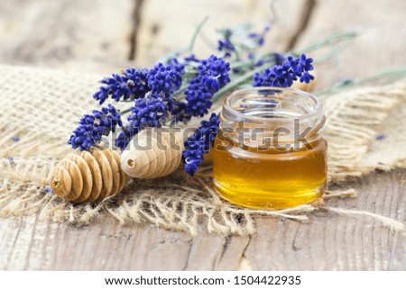 honey and lavender on wooden background