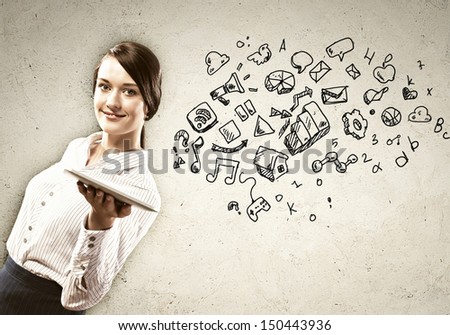 Image of young woman holding in hands ipad