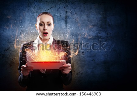 Image of astonished business woman holding ipad