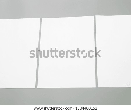 Poster mock-ups paper, white paper isolated on gray background, Blank portrait A4. brochure magazine isolated on gray, can use banners products business texture background for your.