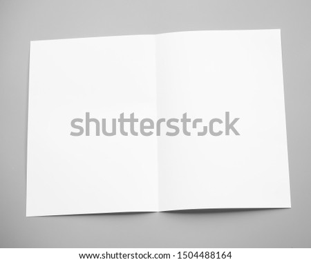 Poster mock-ups paper, white paper isolated on gray background, Blank portrait A4. brochure magazine isolated on gray, can use banners products business texture background for your.