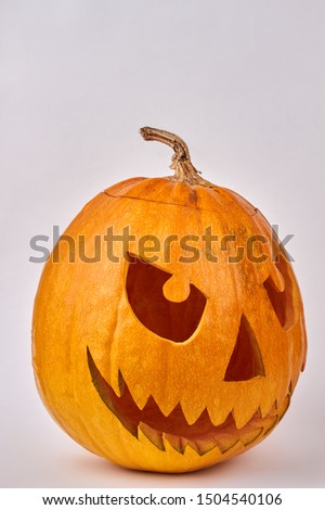 Halloween pumpkin with angry face. Carved pumpkin for Halloween holiday. Easy pumpkin carving ideas.