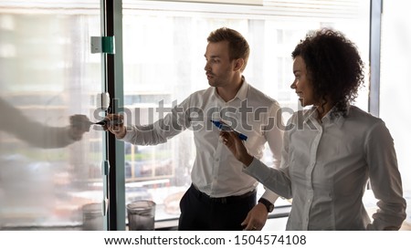 Horizontal banner african woman european man writing on white board presentation in board room, diverse entrepreneurs noting points, describe issues, creating business plan at group meeting in office