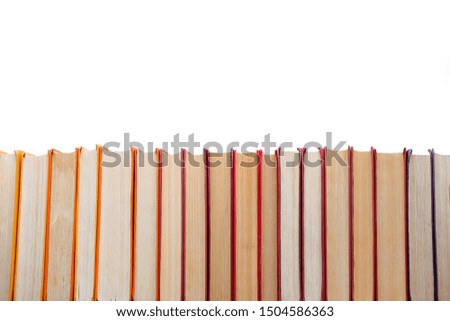 Pile of vintage paper orange books in hard cover. Fall reading list