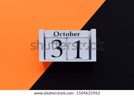 Halloween decorations on a orange and black background