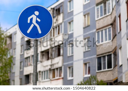 sign pedestrian zone on the background of houses