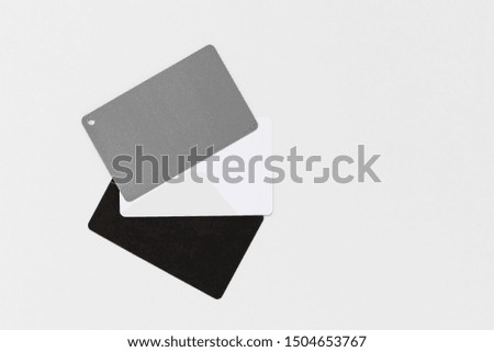 Photography grey card for white balance isolated on a white background, with copy space