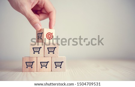 Sale volume increase make business success,  Flips cube with icon goal and shopping cart symbol. Royalty-Free Stock Photo #1504709531