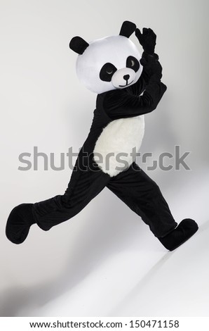 Man in panda costume over white background