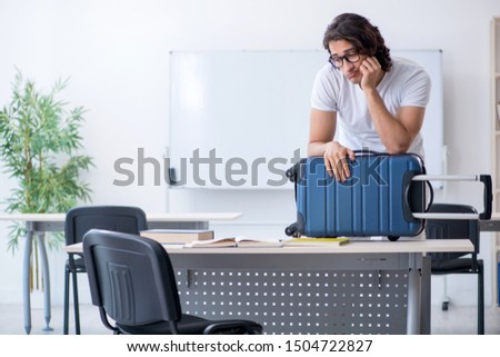 Young male student in front of whiteboard