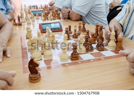 People play chess. Game process. Development of the concept of intellectual game, attraction of masses to chess lessons