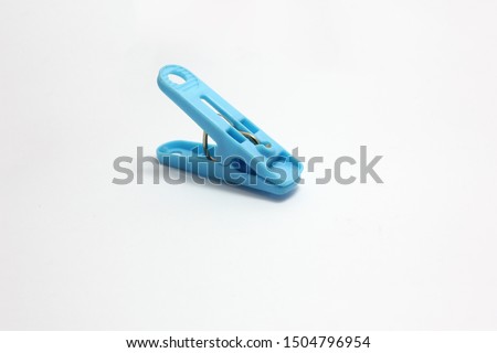 plastic​ clothespins blue​ color​​ isolated​ on​ white​ background.