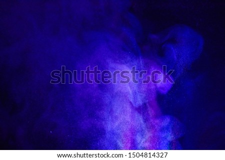 
powder of Galaxy and Nebula color spreading effect for makeup artist or graphic design in black background 