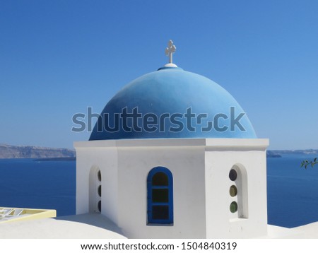 The famous blue domes on the cubiform whitewashed buildings, in the Greek Village of Oia on the Island of Santorini. Royalty-Free Stock Photo #1504840319