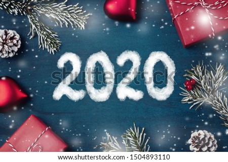 Christmas composition - gifts, decorations and inscription 2020 on a textured background, copy space, place for text