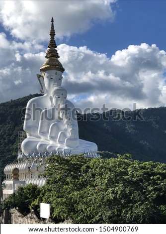 Picture of 3 big white Buddha statues, a beautiful complex mountain background At Pha Son Kaew Temple Phetchaboo