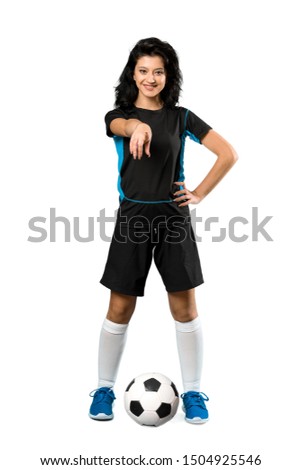 A full-length shot of a Young football player woman over isolated white background