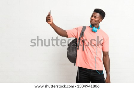 Young afro american man student making a selfie