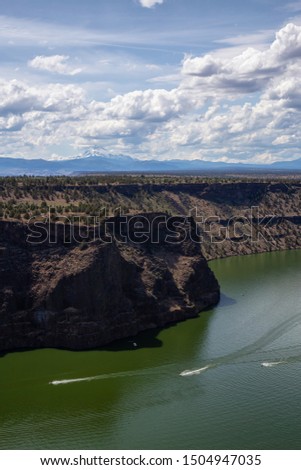 Beautiful View of The Cove Palisades State Park during a cloudy and sunny summer day. Taken in Oregon, United States of America.
