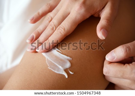 Woman put the cream on skin.  Royalty-Free Stock Photo #1504967348