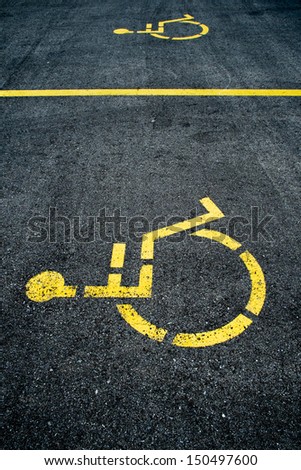 Concrete handicapped sign with wheelchair