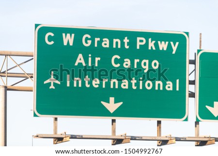 Air cargo freight commercial international airport direction road green sign to West Grant parkway exit in Atalnta, Georgia city