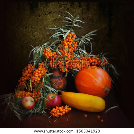 The picture was taken in September 2019.The picture shows a vase with sea buckthorn berries, pumpkin, squash, apples